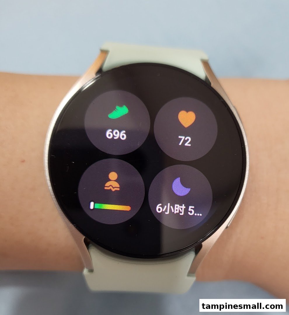 A close-up of a Samsung smartwatch on a wrist, displaying health and activity tracking data.