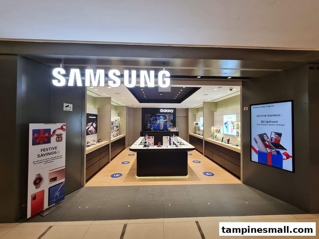 The brightly lit entrance of a Samsung Experience Store, showcasing various electronic products and promotional displays.