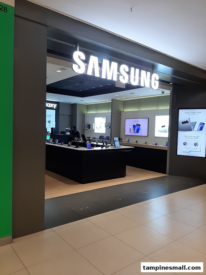 The image captures the inviting entrance of a Samsung Experience Store, showcasing its illuminated logo and modern interior displays.