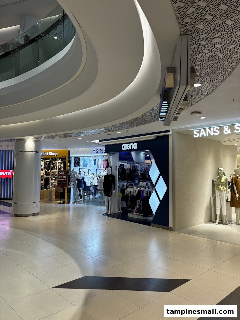 View of SANS SANS shop entrance with mannequins and other retail stores in a modern mall setting.