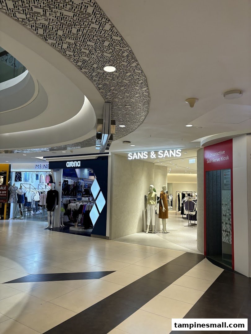 The entrance of SANS & SANS fashion store, featuring mannequins and an interactive self-serve kiosk.