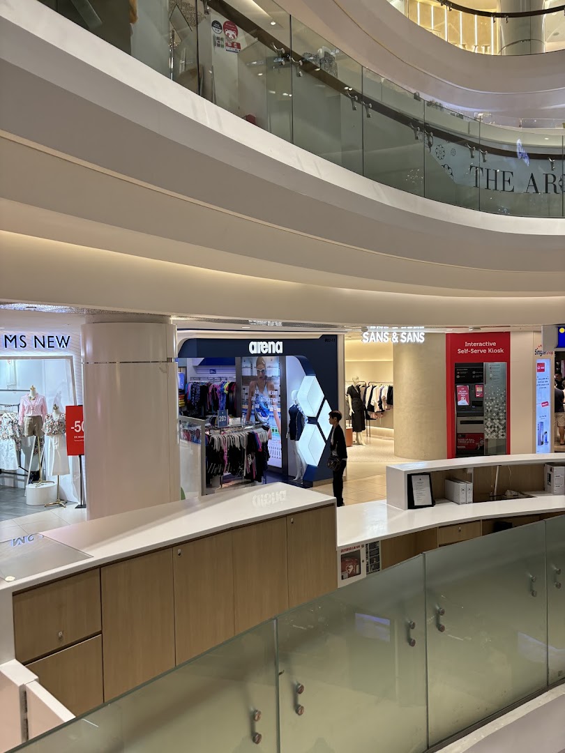 The SANS & SANS shop front, showcasing its entrance and surrounding mall environment.