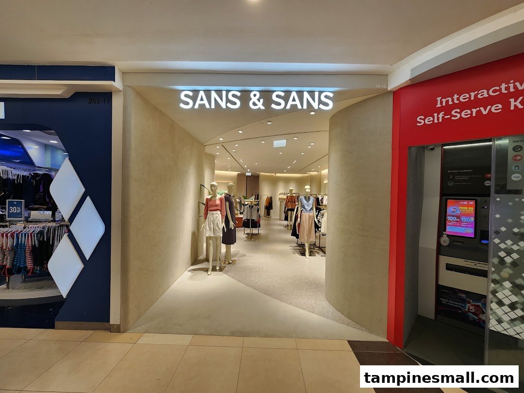 The entrance of SANS & SANS fashion store, showcasing mannequins and apparel inside.