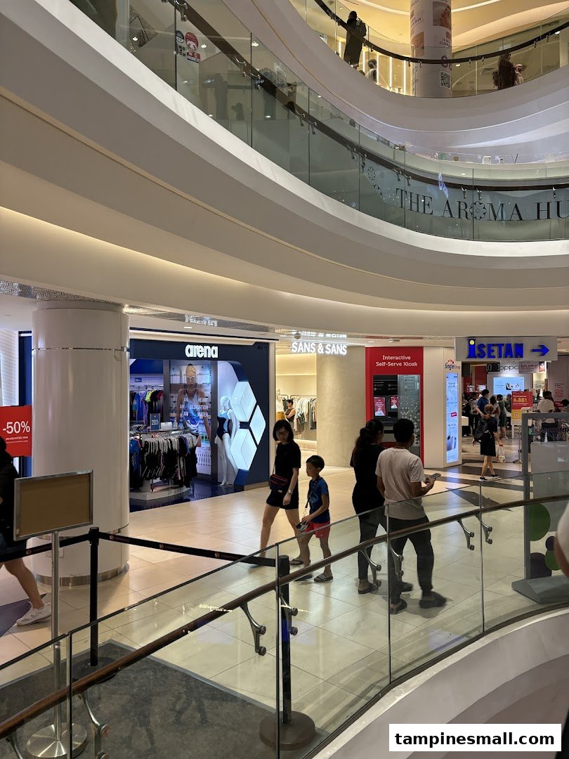 An interior view of Tampines Mall showcasing SANS & SANS and other retail stores.