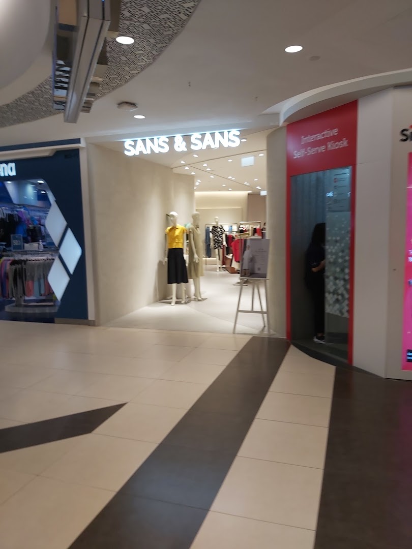 The entrance of SANS & SANS fashion store, featuring mannequins and a nearby interactive self-serve kiosk.