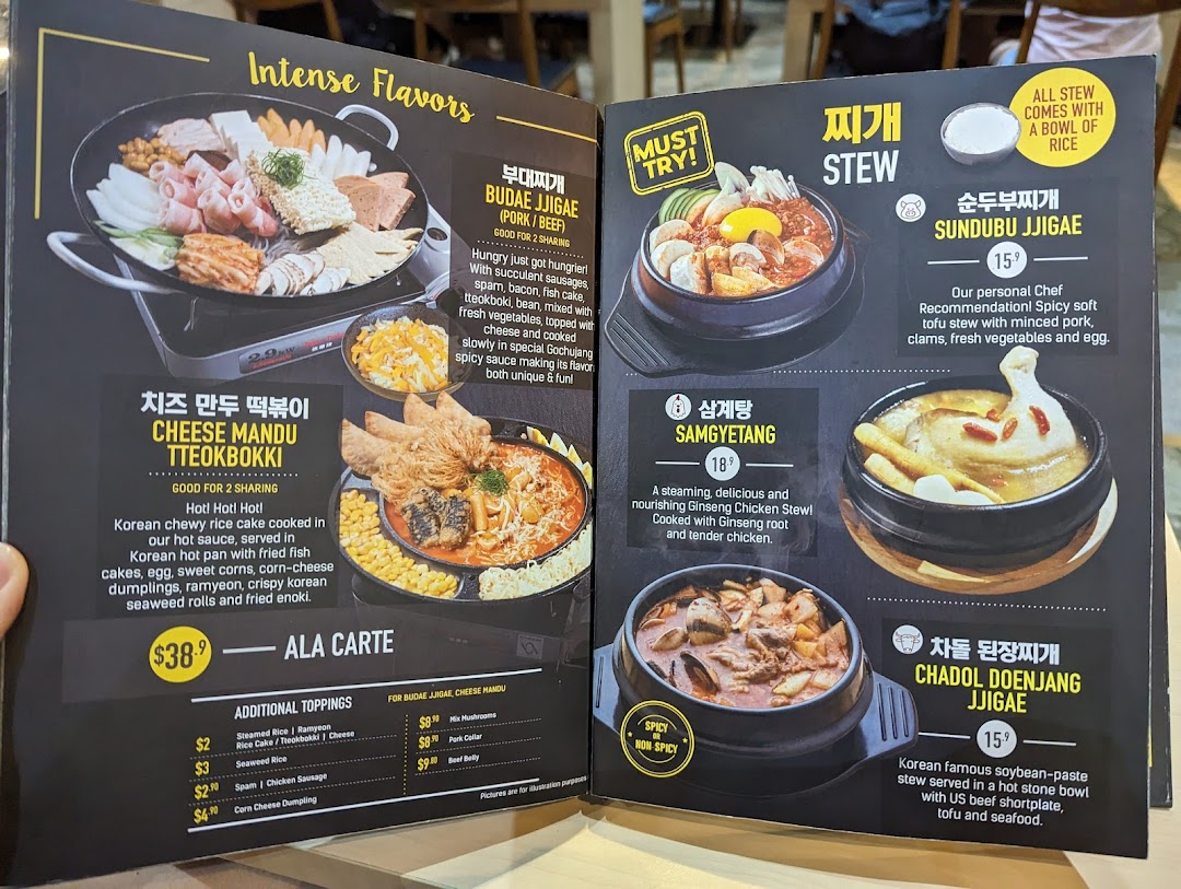 A detailed menu from Seorae Jib showcasing various Korean stews, hot pots, and additional toppings.