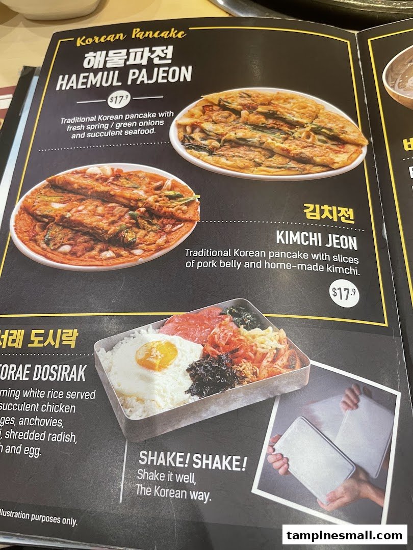A close-up view of a Korean restaurant menu featuring pancakes and a dosirak meal.