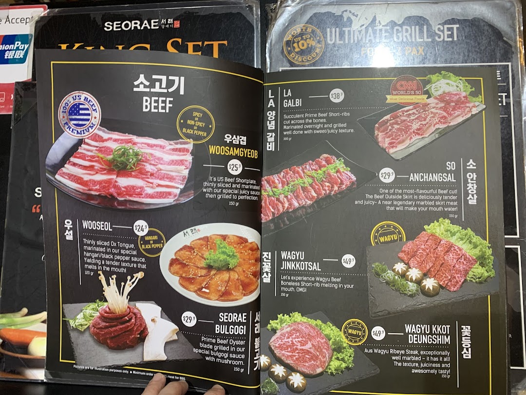 A detailed menu page from Seorae Jib, showcasing various premium beef and Wagyu cuts for grilling.