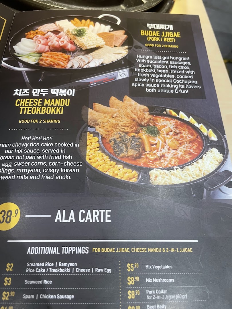 A menu page showcasing Korean hot pot dishes and various toppings with descriptions and prices.