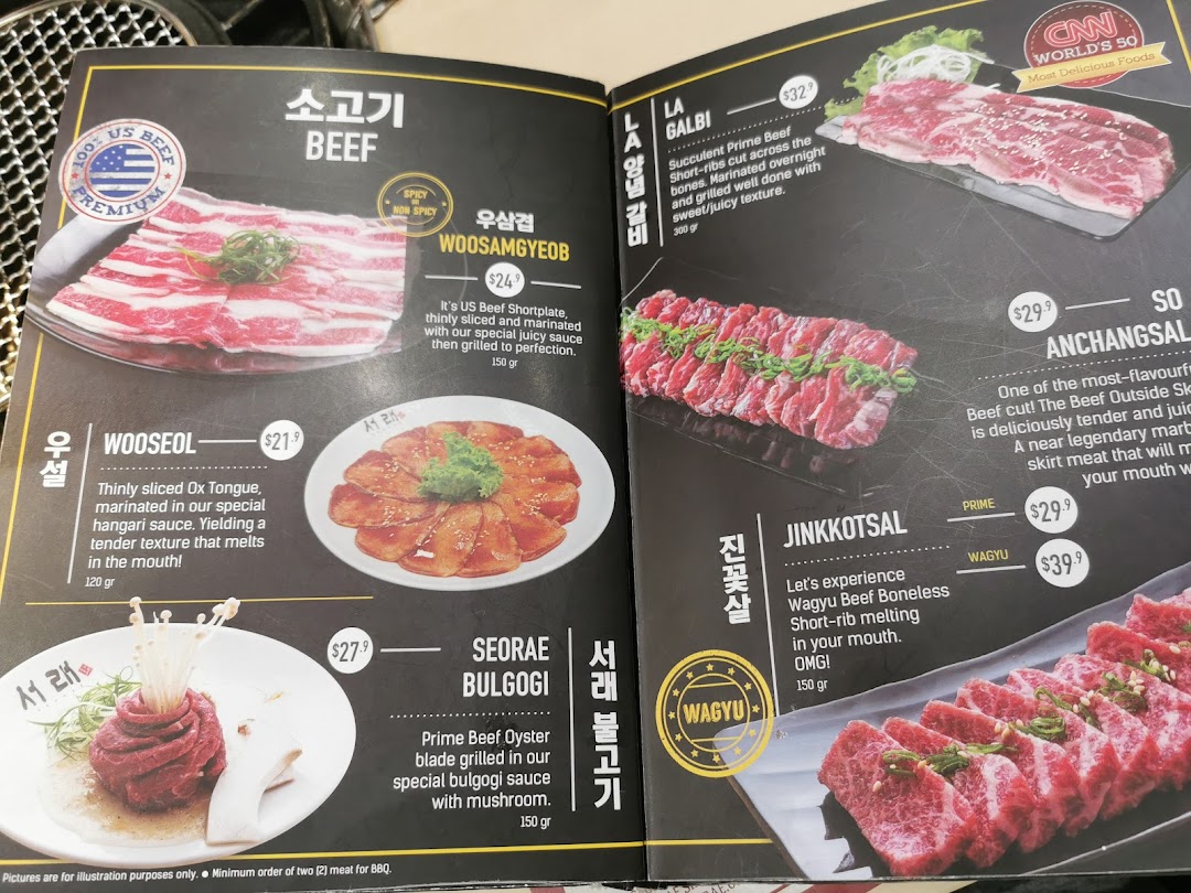 A detailed menu displaying various premium beef cuts and Korean BBQ dishes with prices and descriptions.