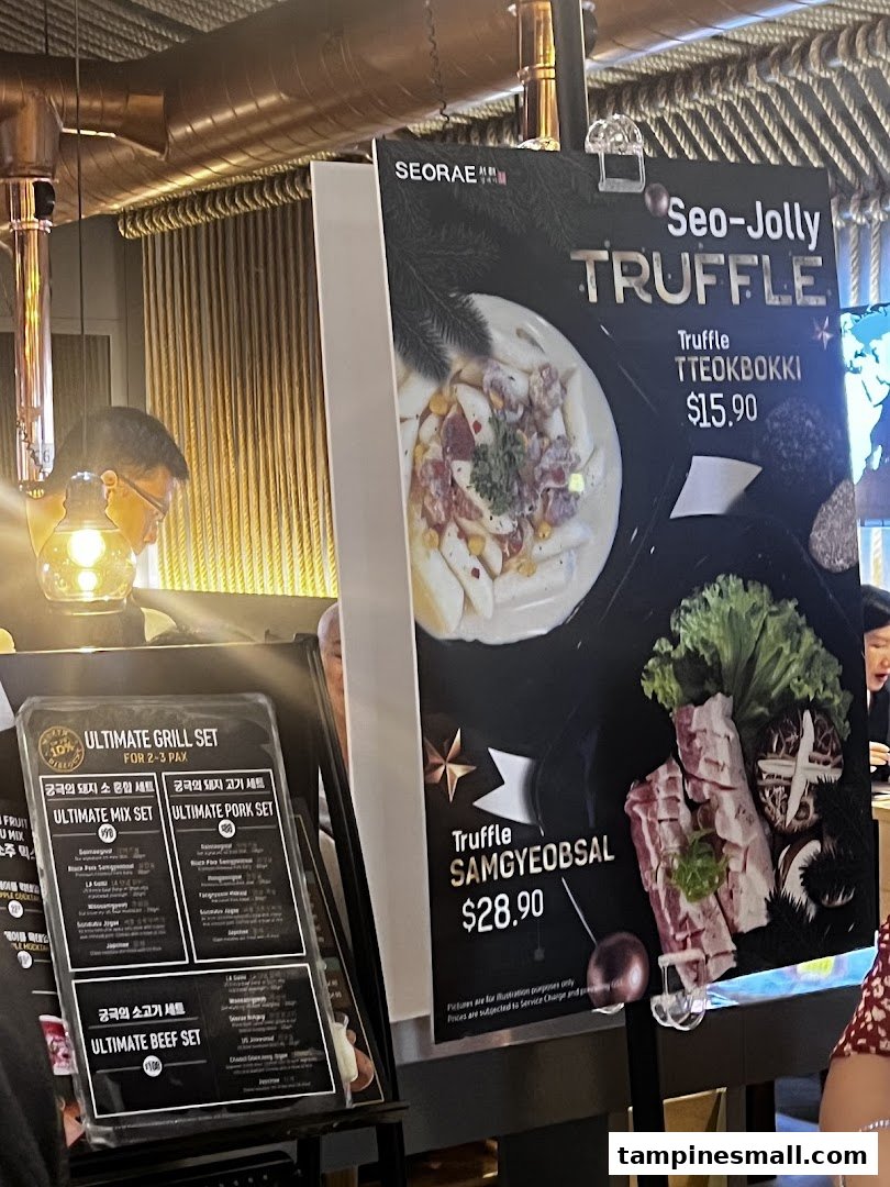 Image shows large menu displays for truffle tteokbokki and samgyeobsal, alongside a smaller menu for grill sets.