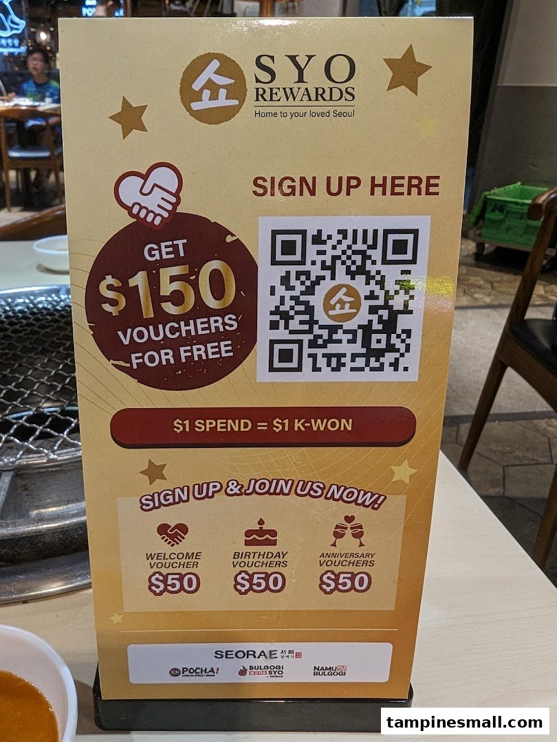 A promotional stand for SYO Rewards offering $150 in vouchers for free upon sign-up.