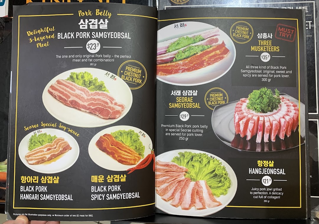 A detailed menu showcasing various premium black pork cuts and Korean BBQ dishes.