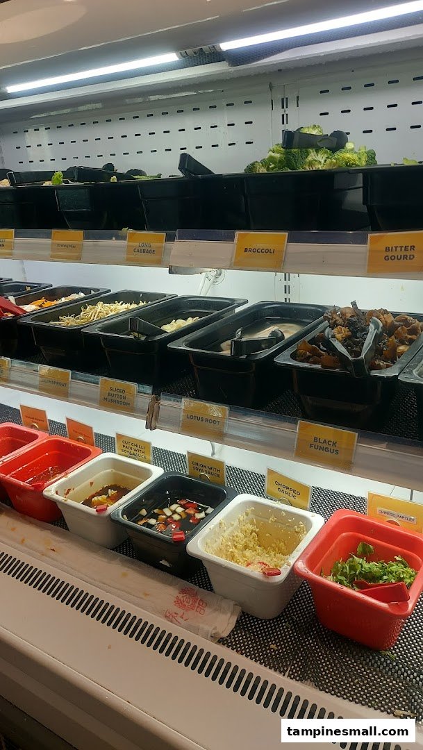 A vibrant display of fresh vegetables, mushrooms, and various condiments for a customizable meal.