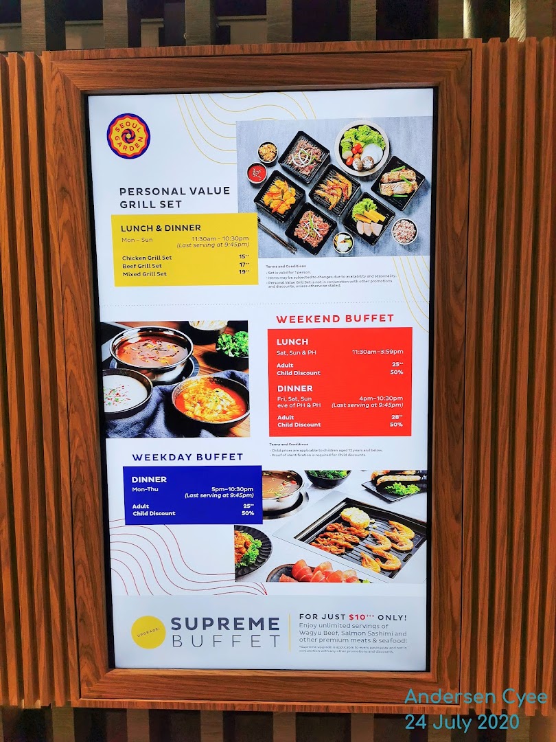 A digital menu board for Seoul Garden, displaying various grill sets and buffet options with prices and timings.