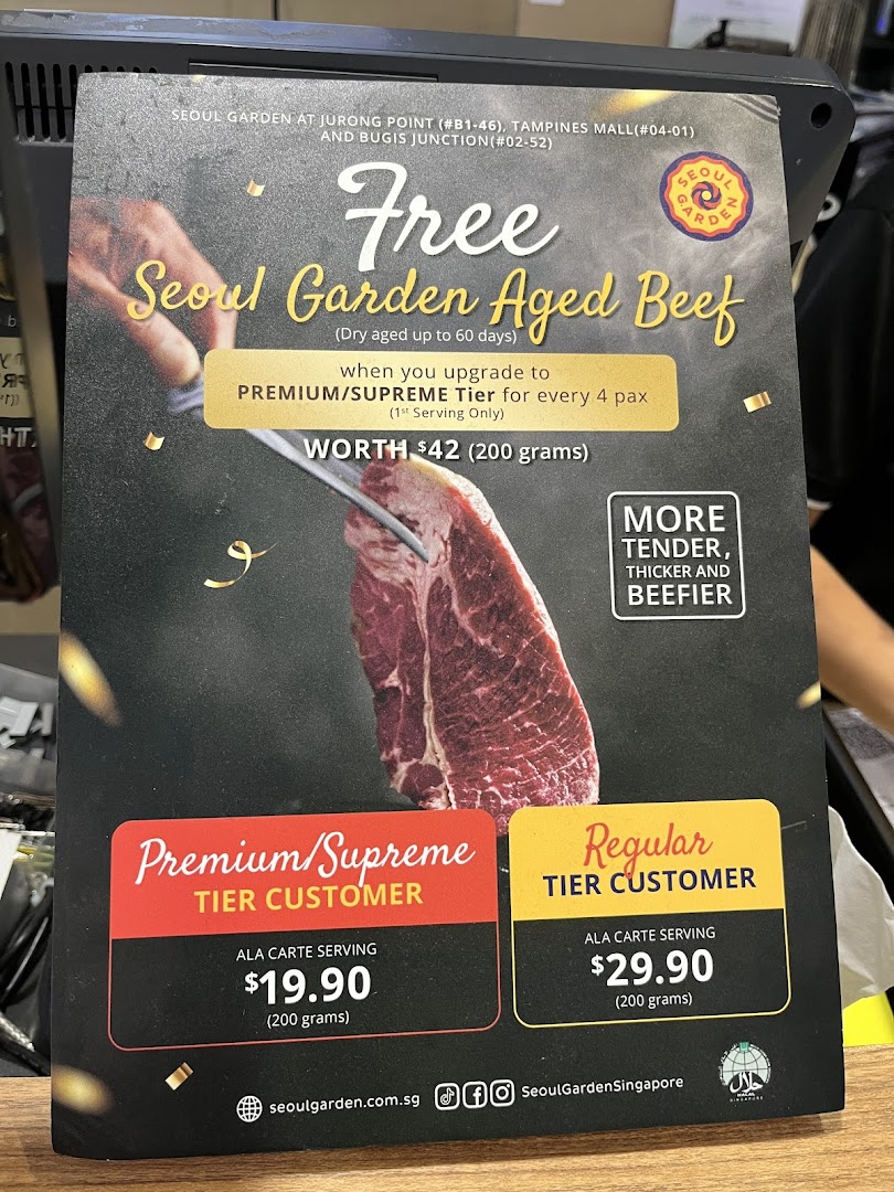 A promotional poster for Seoul Garden's aged beef offer and ala carte pricing for different customer tiers.