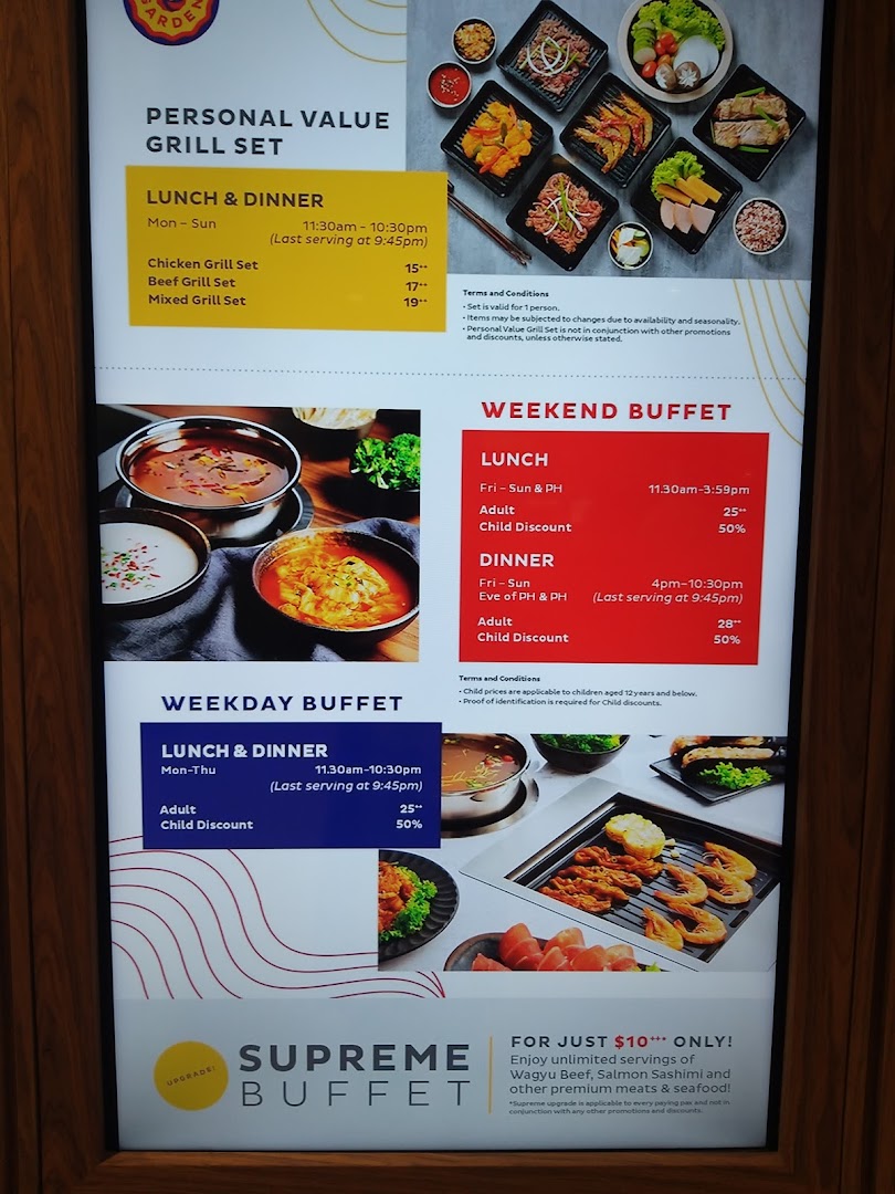 A bright display showcasing Seoul Garden's grill sets, weekend and weekday buffet prices, and supreme buffet upgrade.