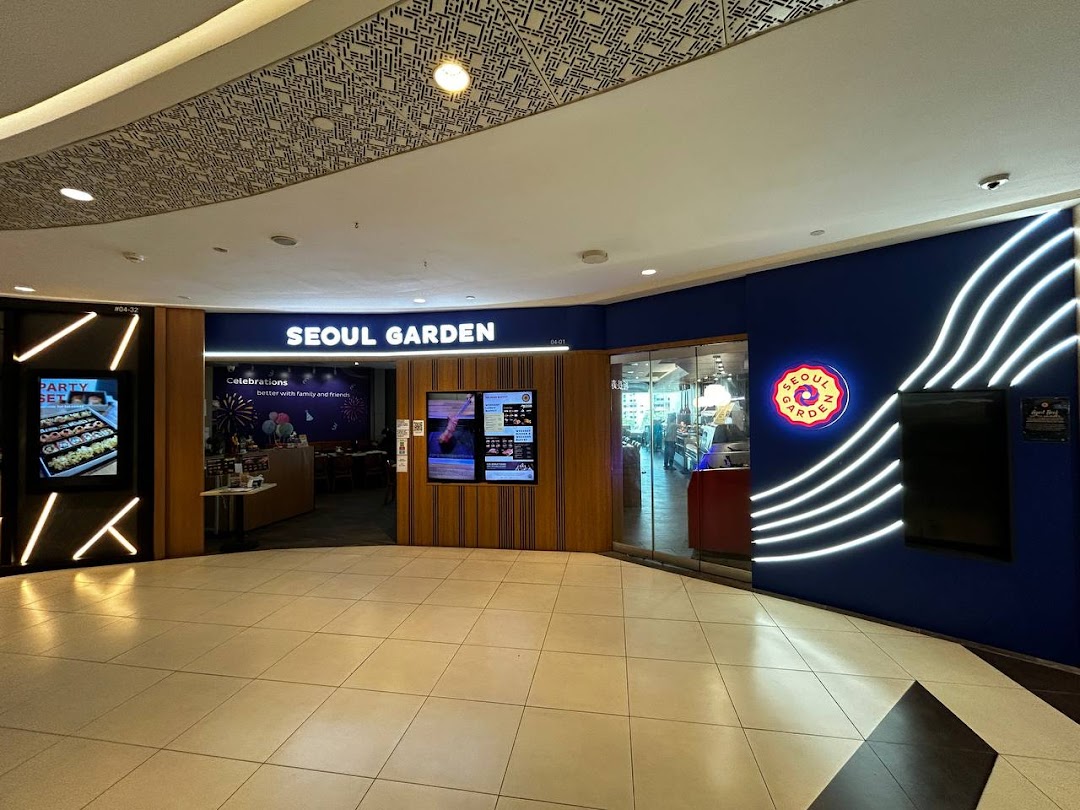 The vibrant blue shopfront of Seoul Garden, a Korean BBQ and hotpot restaurant, with bright signage and entrance.