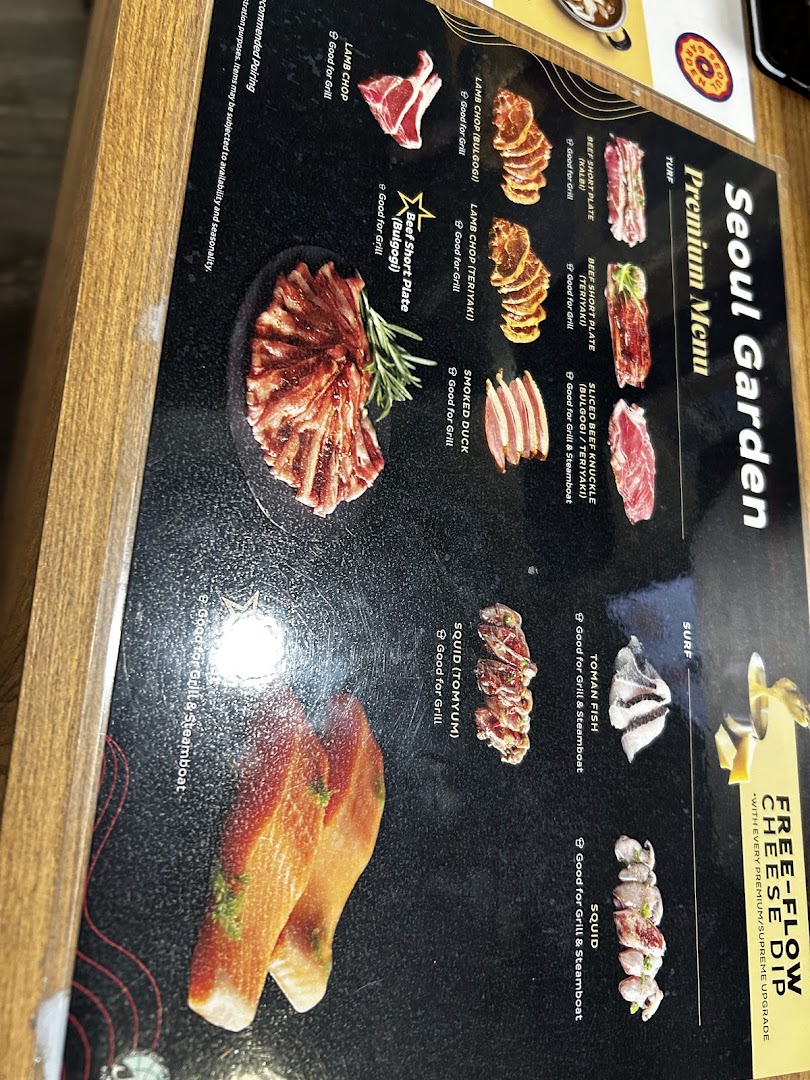 A close-up of Seoul Garden's premium menu, showcasing various meats and seafood for grilling and steamboat.