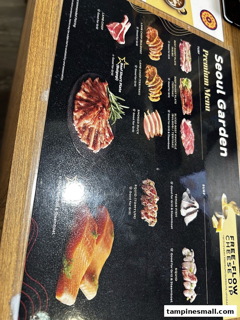 A close-up of Seoul Garden's premium menu, showcasing various meats and seafood for grilling and steamboat.