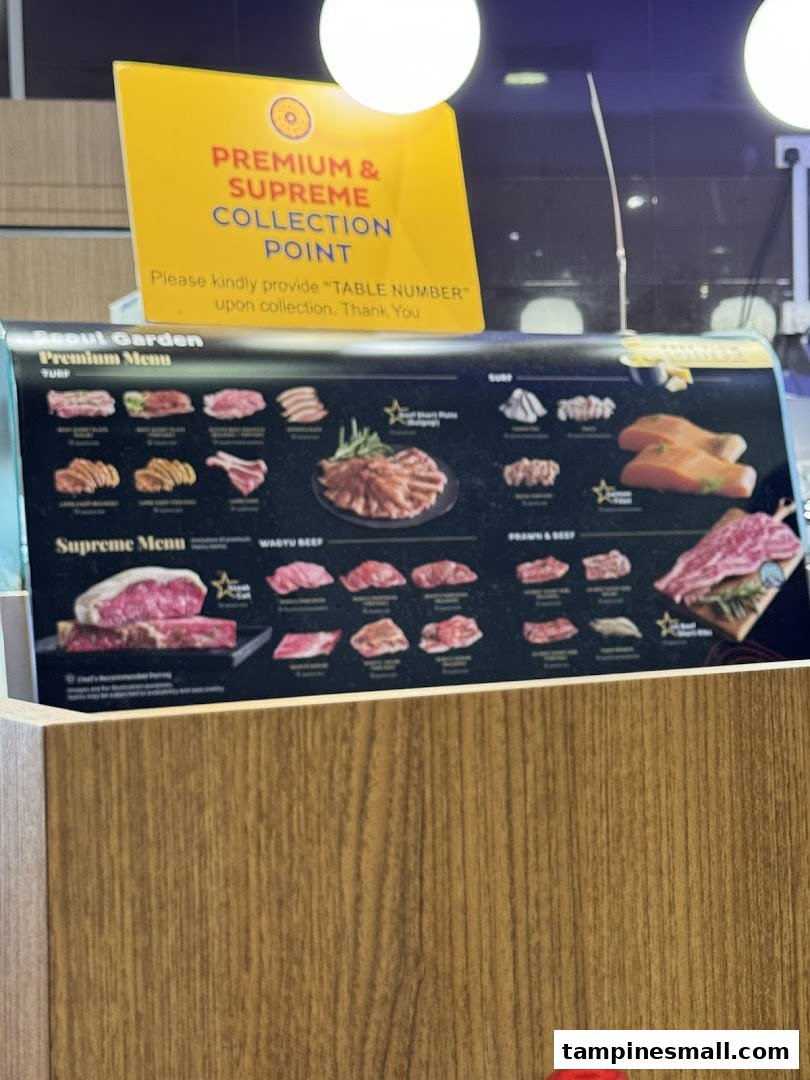 A menu board displaying premium and supreme meat cuts for a Korean BBQ restaurant, with a collection point sign.