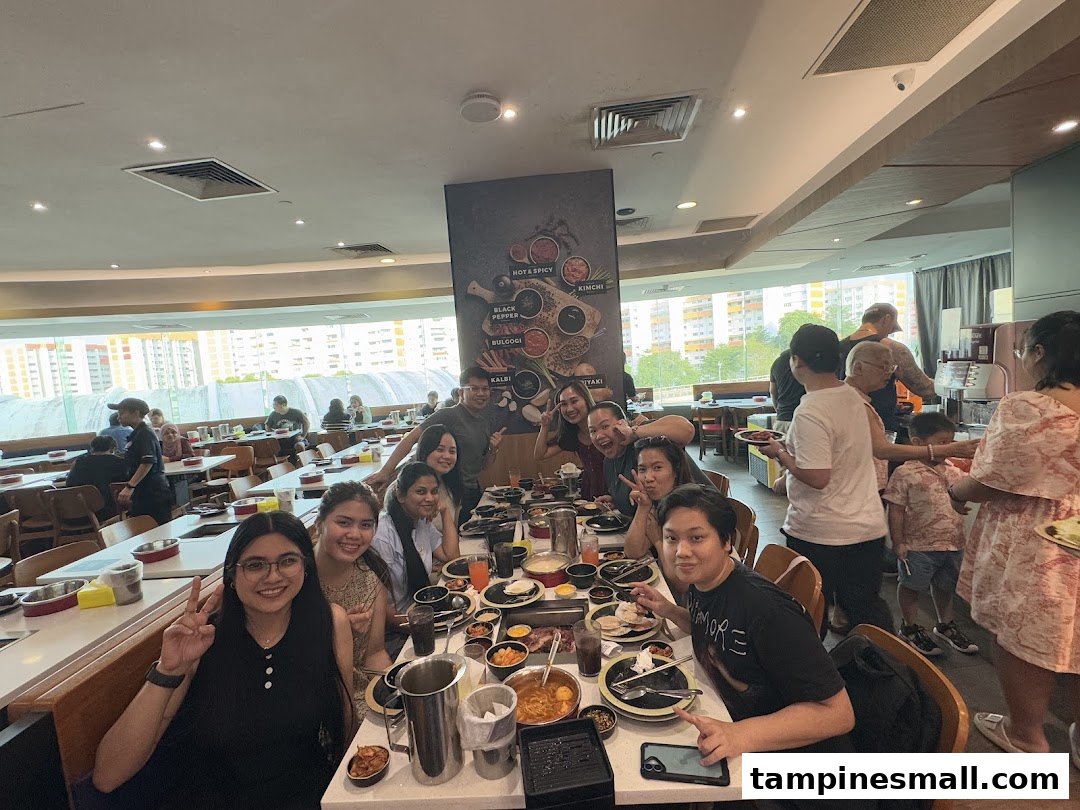 A lively group of friends enjoying a hotpot and grill meal together at Seoul Garden.