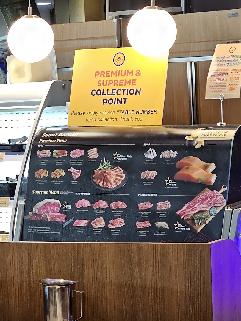 A display board showcasing various premium and supreme meat and seafood options available at Seoul Garden.