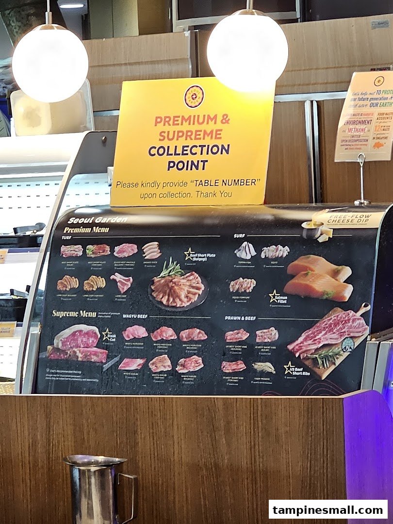 A display board showcasing various premium and supreme meat and seafood options available at Seoul Garden.