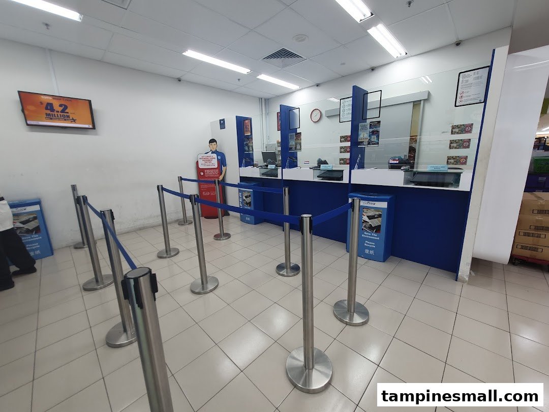 Interior view of a Singapore Pools counter with queue barriers and service desks inside NTUC FairPrice.