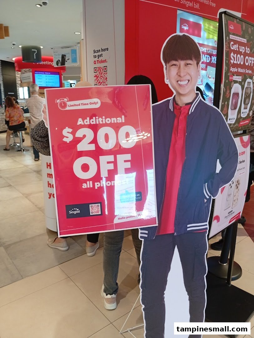 Interior view of a Singtel shop featuring promotional displays for phone and Apple Watch discounts.