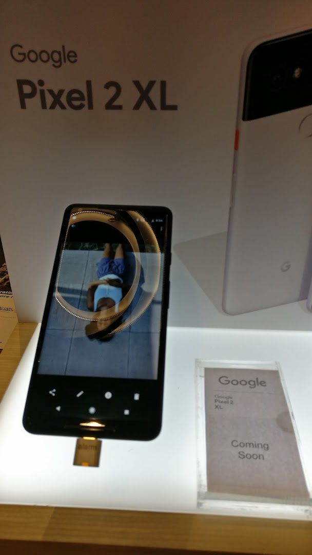 A close-up of a Google Pixel 2 XL smartphone on display at Singtel, showcasing its features.