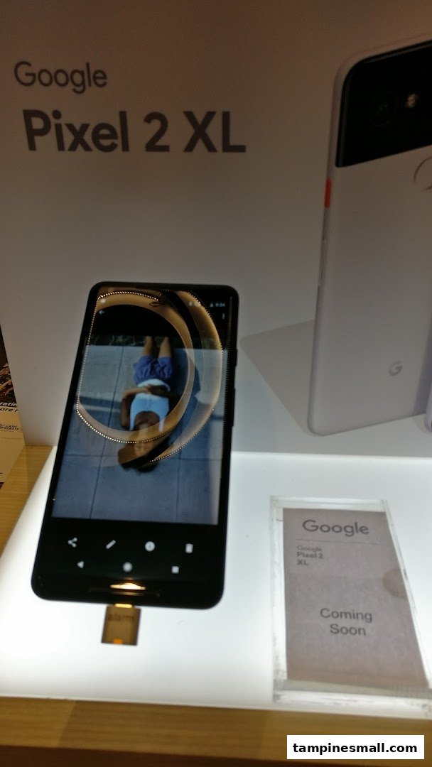 A close-up of a Google Pixel 2 XL smartphone on display at Singtel, showcasing its features.