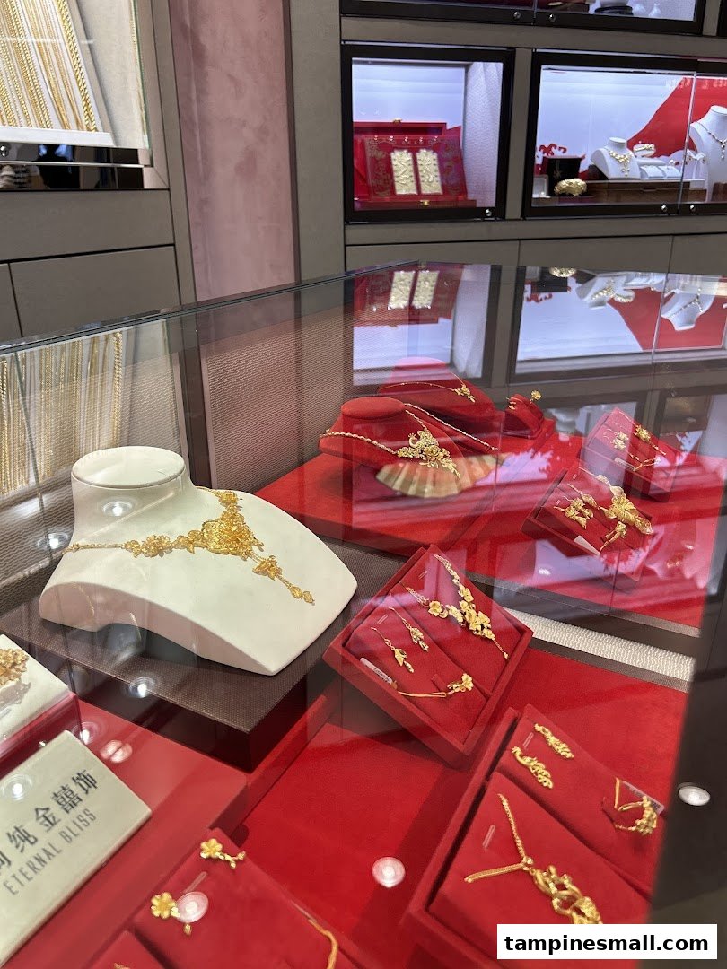 A close-up view of intricate gold jewelry displayed in glass cases at SK Gold.