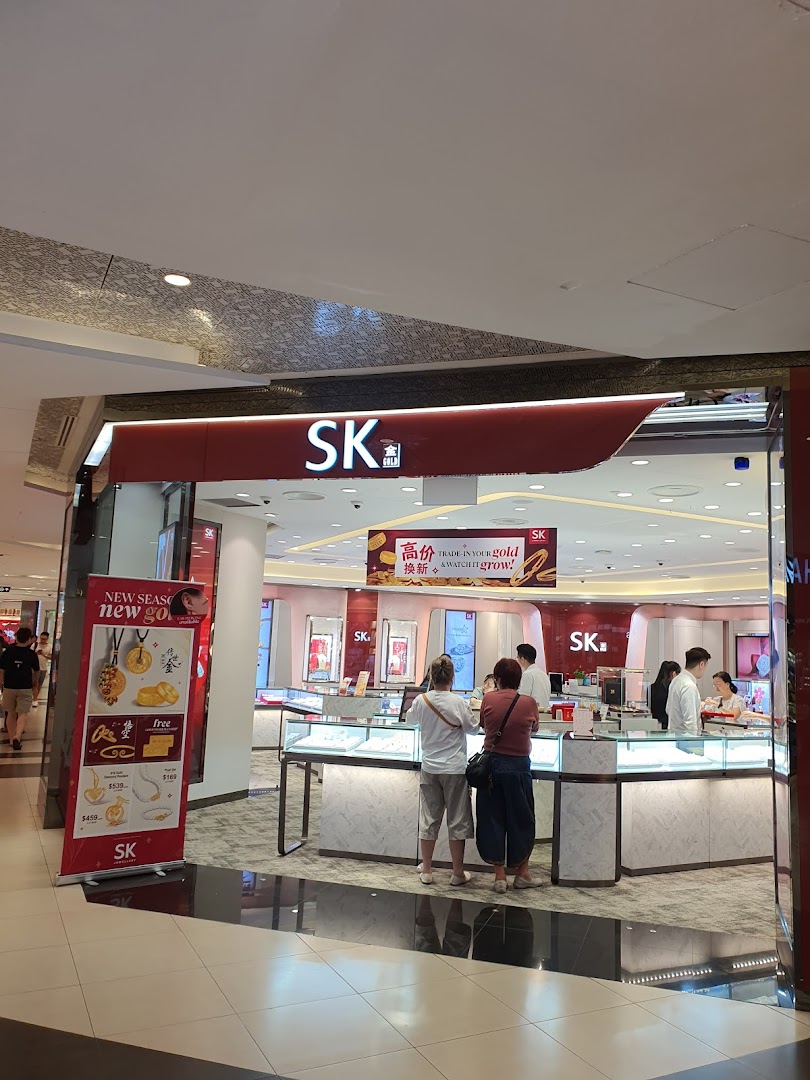 The storefront of SK Gold at Tampines Mall, showcasing its interior with customers browsing gold and jewelry.