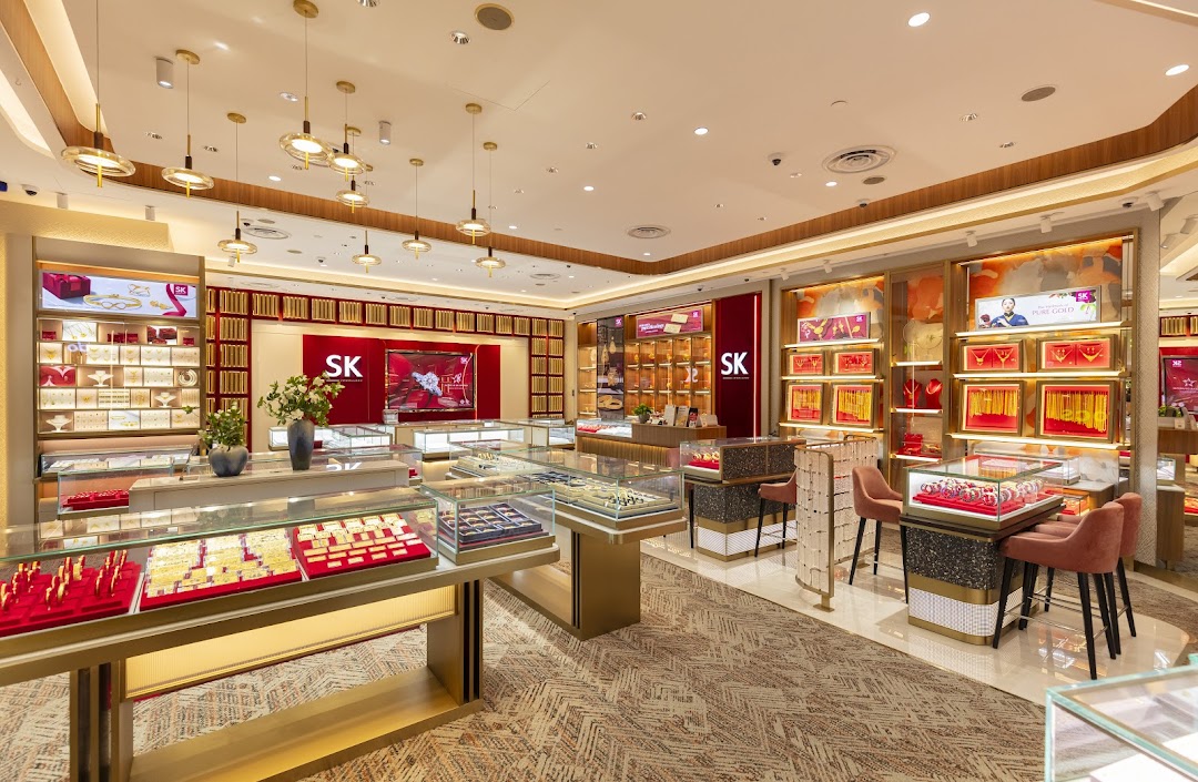 Interior view of SK Jewellery shop with display cases showcasing gold and precious jewellery.