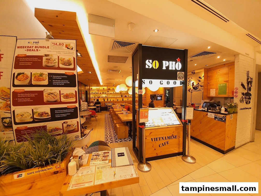 The inviting entrance of So Pho Vietnamese Cafe, showcasing its bright interior and promotional deals.