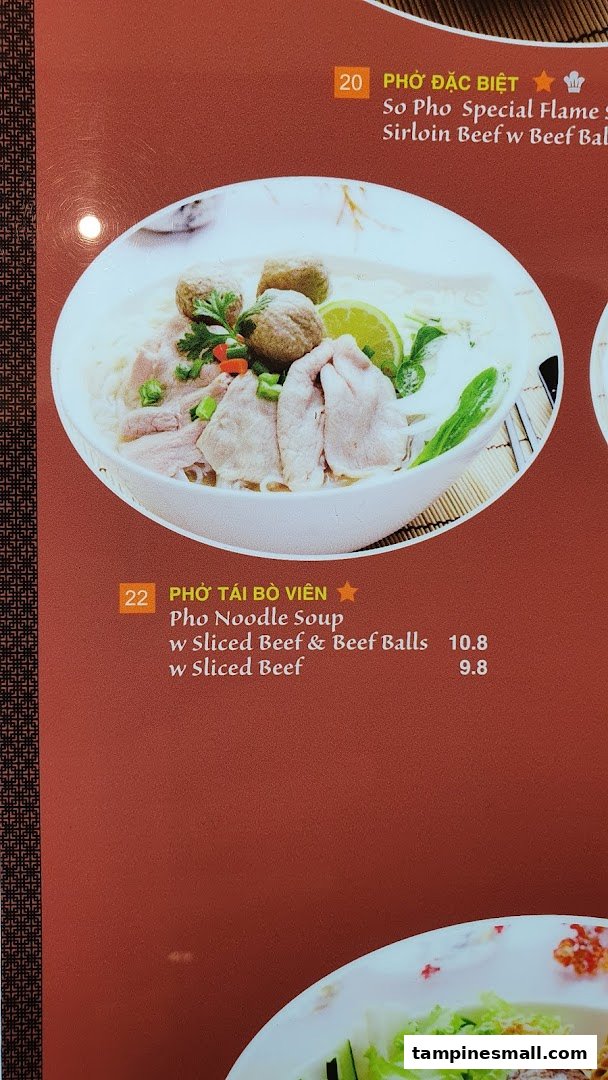 A close-up of a menu displaying two Pho noodle soup options with prices and descriptions.
