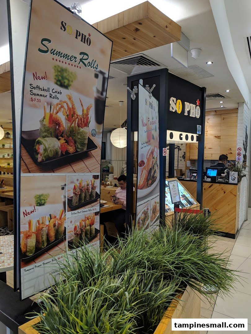 Promotional banners at So Pho's entrance showcasing various summer rolls with prices.