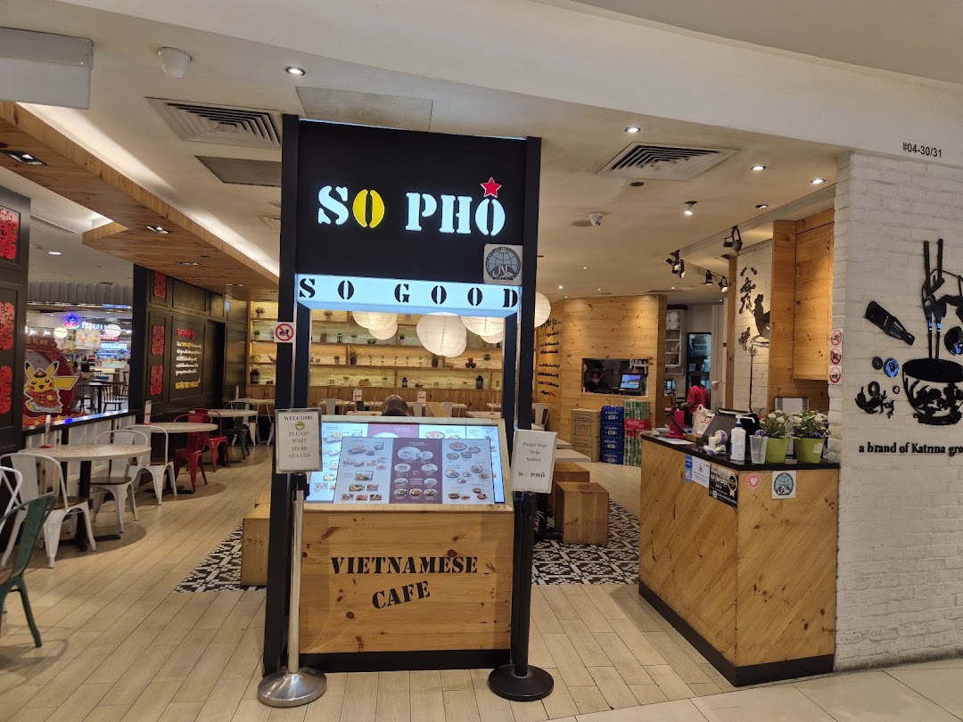 The inviting entrance of So Pho Tampines Mall, a Vietnamese cafe, featuring its prominent sign and warm interior.