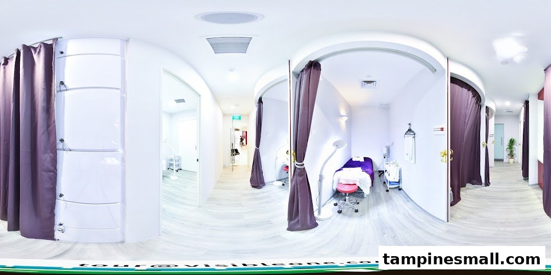 Interior view of a wellness center featuring private treatment rooms with curtains and modern decor.