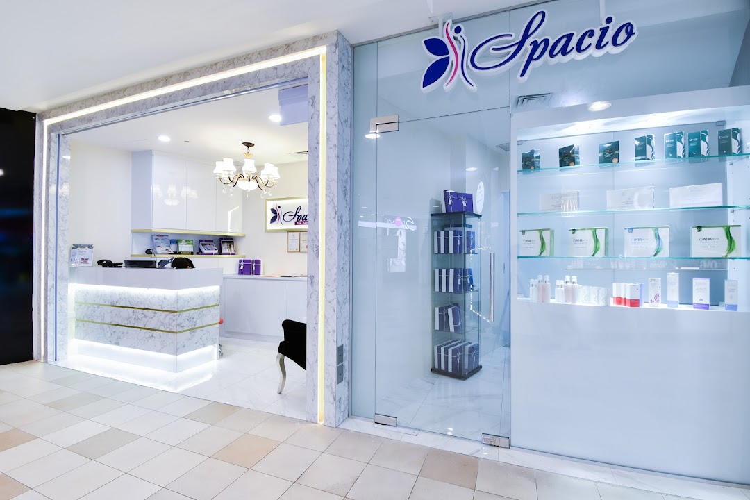 The bright, modern shop front of Spacio TCM Wellness with a reception area and product display.