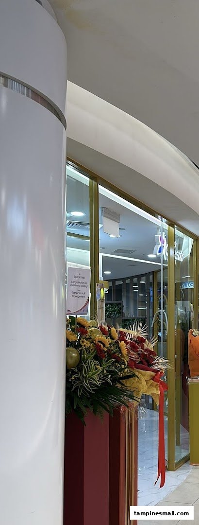The grand opening of Spacio TCM Wellness Tampines, featuring a vibrant floral arrangement at the shop entrance.