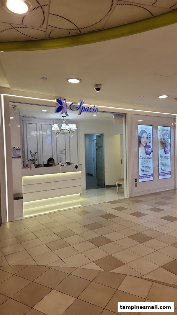 The brightly lit entrance of Spacio TCM Wellness, featuring a modern reception desk and inviting displays.