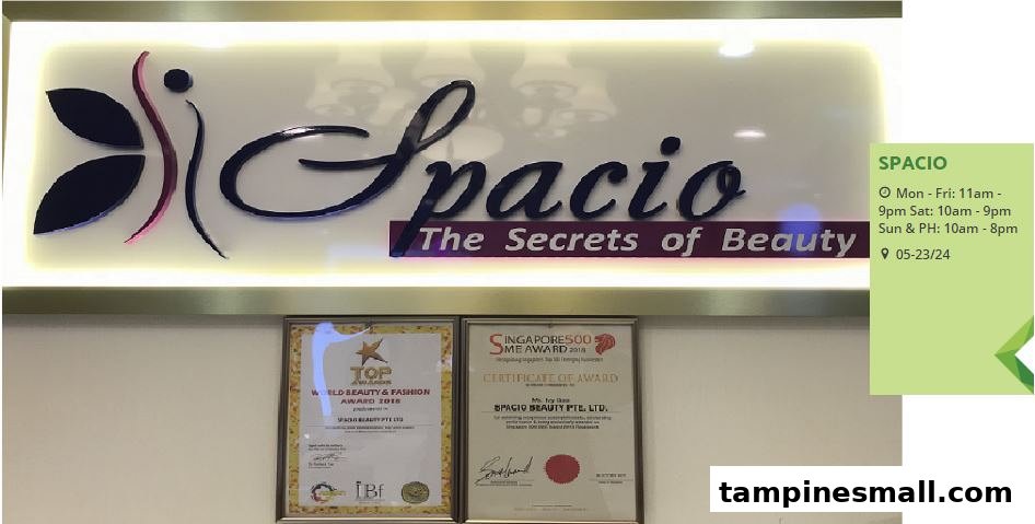 Spacio's illuminated sign displaying 'The Secrets of Beauty' alongside prestigious awards and operating hours.