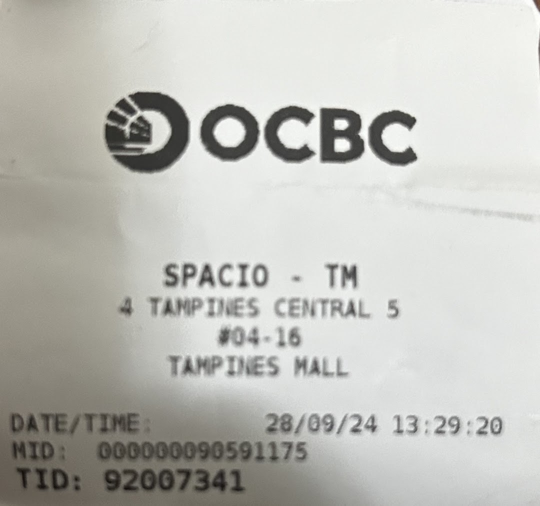 A payment receipt from Spacio TCM Wellness showing transaction details and mall address.