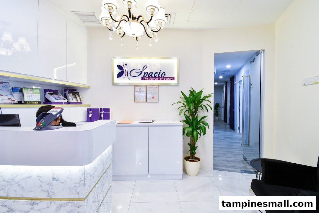 Bright, modern reception area of Spacio TCM Wellness with a white marble counter and elegant decor.
