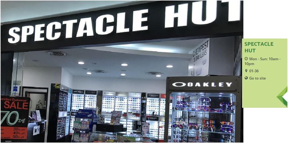 The storefront of Spectacle Hut, an eyewear shop, featuring displays of glasses and a sale promotion.