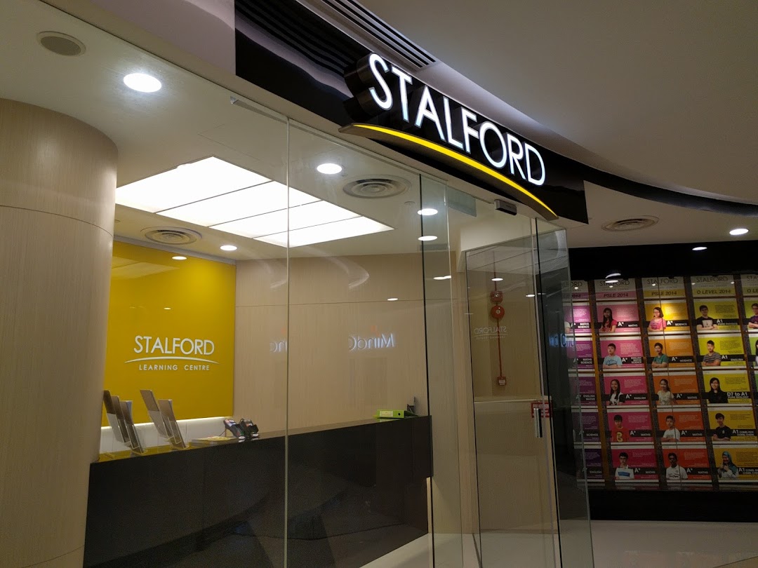 The bright entrance of Stalford Learning Centre, featuring its logo and a glimpse of the interior.