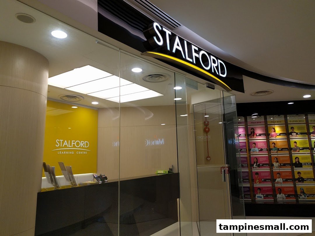 The bright entrance of Stalford Learning Centre, featuring its logo and a glimpse of the interior.