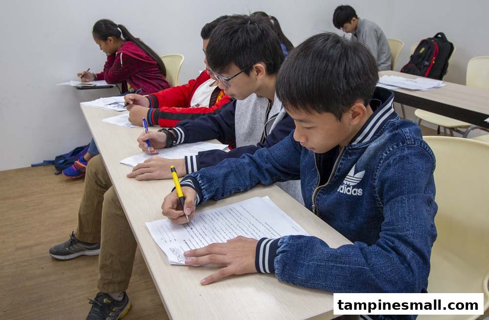Students diligently writing in a classroom at Stalford Learning Centre.